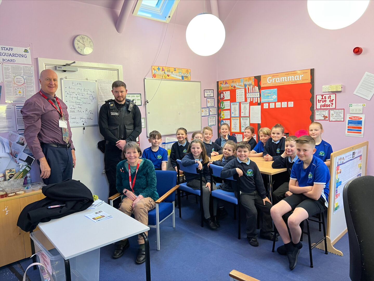 The image is of Deputy PCC Andy Pratt, local PCSO Rob Dolan, Councillor Jackie Oakes and Northern Primary School School Council next to board with small road safety plan on